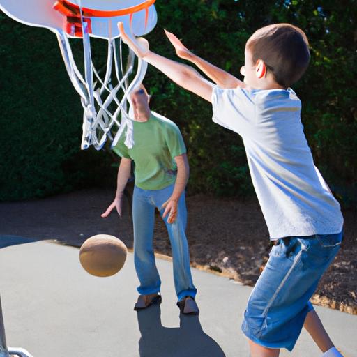 Bé trai và bố vui chơi bóng rổ bằng khung treo nhỏ