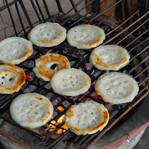 Nướng bánh tráng lụi giòn tan - Grilling crispy bánh tráng lụi over charcoal fire