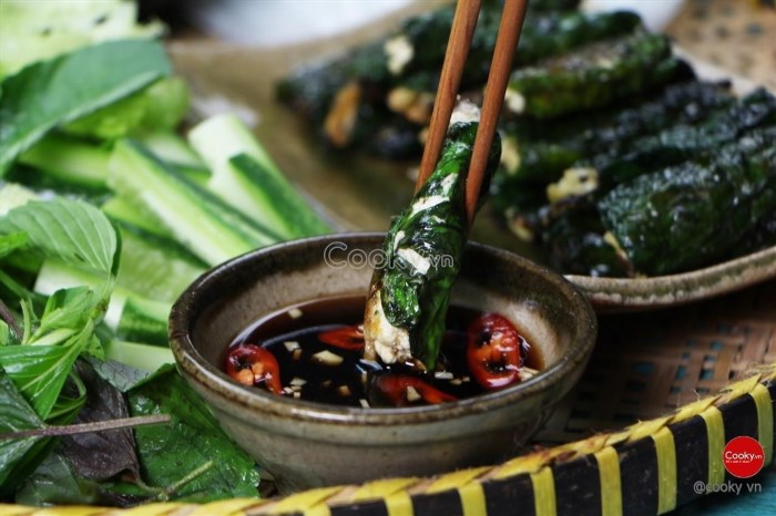 Đậu hũ cuốn lá lốt là món ăn truyền thống Việt Nam với hương vị đậm đà của đậu hũ và mùi thơm của lá lốt, thường được ăn kèm với nước chấm ngon và rau sống tươi mát.